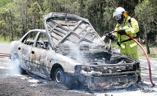 A driver escaped his burning vehicle without injury on the Childers Road at Cordalba yesterday. A driver escaped his burning vehicle without injury on the Childers Road at Cordalba yesterday.